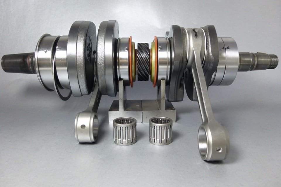 Rebuilt 2-stroke snowmobile crankshaft with new bearings and seals